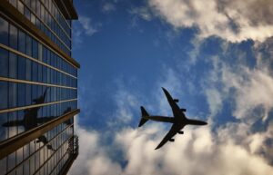 Passenger jet flying against a blue sky